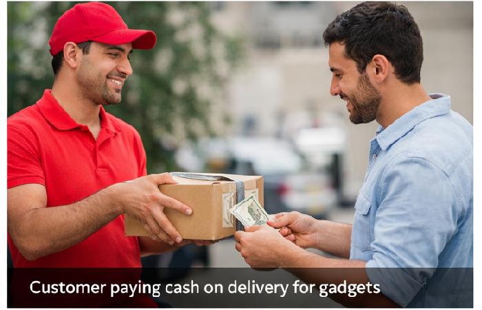Customer paying cash on delivery for gadgets